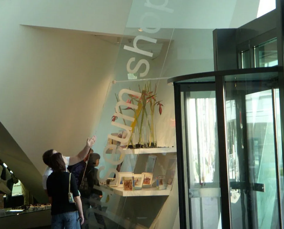 Etched storefront window glass in a retail space, done on site