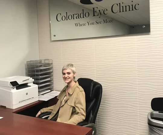 Colorado Eye Clinic etched glass sign in a reception area