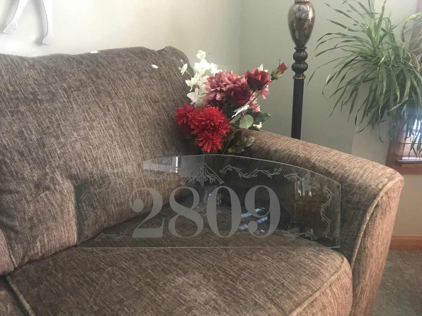 Glass tabletop etched with the house number 2809